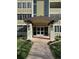 The building's welcoming entrance features modern architecture and professional landscaping at 750 S Alton Way # 8C, Denver, CO 80247