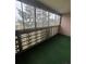 Relaxing sunroom with patterned privacy panels and green carpet at 750 S Alton Way # 8C, Denver, CO 80247