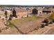 An aerial shot showcasing a sprawling backyard, complete with fencing, a patio, and a playground at 1235 Woodmoor Acres Dr, Monument, CO 80132