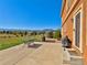 Spacious patio with mountain views, ideal for outdoor entertaining, featuring ample space for dining and grilling at 1235 Woodmoor Acres Dr, Monument, CO 80132