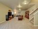 Finished basement with a large TV and comfortable seating at 1235 Woodmoor Acres Dr, Monument, CO 80132