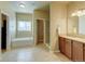 Well-lit bathroom featuring a soaking tub, walk-in shower, and granite countertops at 1235 Woodmoor Acres Dr, Monument, CO 80132