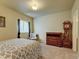 Basement bedroom with a wooden dresser and grandfather clock at 1235 Woodmoor Acres Dr, Monument, CO 80132