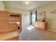 Bright bedroom with a built-in bunk bed and ample closet space at 1235 Woodmoor Acres Dr, Monument, CO 80132