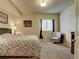 Basement bedroom with gray bedding and an armchair at 1235 Woodmoor Acres Dr, Monument, CO 80132