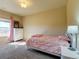 Bedroom with a white dresser and pink bedding at 1235 Woodmoor Acres Dr, Monument, CO 80132