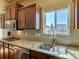 Kitchen features granite countertops, stainless steel sink, and microwave at 1235 Woodmoor Acres Dr, Monument, CO 80132