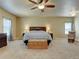 Serene main bedroom with large windows, soft carpet, and a comfortable king-size bed at 1235 Woodmoor Acres Dr, Monument, CO 80132