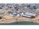 Aerial view of the community amenities, featuring playground, pool and recreation center surrounded by homes at 17926 E 104Th Way # C, Commerce City, CO 80022