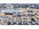 Aerial view of community amenities including pool, recreation center, playground and pond surrounded by homes at 17926 E 104Th Way # C, Commerce City, CO 80022