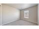 This room has plush carpeting and a large window for natural light at 17926 E 104Th Way # C, Commerce City, CO 80022