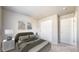This bedroom boasts a neutral color scheme, soft carpet, and a closet at 17926 E 104Th Way # C, Commerce City, CO 80022