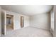 Spacious carpeted bedroom with ample lighting, featuring attached doorways at 17926 E 104Th Way # C, Commerce City, CO 80022