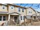 Attractive townhouse exterior featuring well-maintained siding and a fenced-in front yard at 17926 E 104Th Way # C, Commerce City, CO 80022