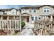 Charming townhome with well-maintained front yard, partial fence, and inviting entrance at 17926 E 104Th Way # C, Commerce City, CO 80022