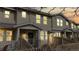 Attractive townhouse exterior with warm lighting, a fenced-in front yard, and welcoming facade at 17926 E 104Th Way # C, Commerce City, CO 80022