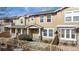 Inviting townhouse with a cozy front porch and well-maintained exterior, complemented by a charming picket fence at 17926 E 104Th Way # C, Commerce City, CO 80022