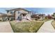 Charming townhome with a well-maintained lawn and landscaped front yard, perfect for outdoor relaxation at 17926 E 104Th Way # C, Commerce City, CO 80022