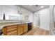 Well-lit kitchen featuring hardwood floors, granite countertops, and an open layout to the living area at 17926 E 104Th Way # C, Commerce City, CO 80022