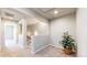 This landing offers plush carpeting and a view into another bedroom at 17926 E 104Th Way # C, Commerce City, CO 80022