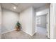 This flex space offers plush carpeting and natural light, with views into another bedroom at 17926 E 104Th Way # C, Commerce City, CO 80022
