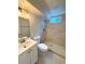 Tiled bathroom with a glass-enclosed shower and modern fixtures at 8239 Nola Dr, Denver, CO 80221