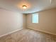 Bedroom with neutral carpet and a window at 8239 Nola Dr, Denver, CO 80221