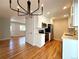 Modern kitchen with stainless steel appliances, white cabinets, and an open layout at 8239 Nola Dr, Denver, CO 80221