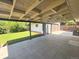 Large covered patio with view of backyard and detached garage at 8239 Nola Dr, Denver, CO 80221