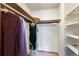 Walk-in closet featuring shelving and clothing racks for optimal storage at 424 Wright St # 102, Lakewood, CO 80228
