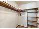 Walk-in closet with wooden shelves and racks, perfect for organized storage at 424 Wright St # 102, Lakewood, CO 80228