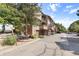 Exterior view of townhomes showcasing private garages and balconies at 424 Wright St # 102, Lakewood, CO 80228