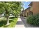 Charming townhomes feature well-maintained landscaping and a sidewalk at 424 Wright St # 102, Lakewood, CO 80228