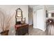Entrance foyer with decorative mirror and closet at 424 Wright St # 102, Lakewood, CO 80228