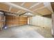 Spacious garage with concrete floor, wooden door, and ample storage space at 424 Wright St # 102, Lakewood, CO 80228