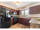 Well-equipped kitchen features modern appliances and ample counter space at 424 Wright St # 102, Lakewood, CO 80228