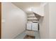 Functional laundry room equipped with modern washer and dryer units at 424 Wright St # 102, Lakewood, CO 80228