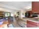 Open layout featuring a modern kitchen island flows into living and dining areas at 424 Wright St # 102, Lakewood, CO 80228