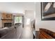Bright living room with a stone fireplace, and a large window at 424 Wright St # 102, Lakewood, CO 80228