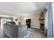 Comfortable living space features a stone fireplace and an adjacent dining area at 424 Wright St # 102, Lakewood, CO 80228