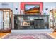 Close-up of the modern fireplace, decor, and beautiful hardwood floors in the living room at 6700 W Dorado Dr # 51, Littleton, CO 80123