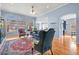 Bright living room featuring large windows, hardwood floors, and an elegant area rug at 6700 W Dorado Dr # 51, Littleton, CO 80123