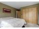 Spacious bedroom with a large closet and an adjacent door provides ample storage at 26367 Pressler St, Conifer, CO 80433