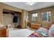 Bedroom featuring a blend of functionality and comfort with its natural light and ample storage solutions at 26367 Pressler St, Conifer, CO 80433
