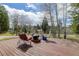 Cozy deck with seating, surrounded by the peaceful views of aspen trees and greenery at 26367 Pressler St, Conifer, CO 80433