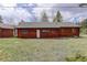 Charming wood home with a neatly maintained yard, perfect for tranquil living with natural light and cozy ambiance at 26367 Pressler St, Conifer, CO 80433