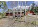Cozy cabin-style house featuring a detached garage and surrounded by aspens and evergreens at 26367 Pressler St, Conifer, CO 80433