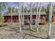 Quaint cabin exterior with a deck, surrounded by the natural beauty of aspen trees at 26367 Pressler St, Conifer, CO 80433