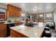 Well-equipped kitchen with island cooktop, ample countertop space, and inviting breakfast nook at 26367 Pressler St, Conifer, CO 80433