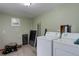 Functional laundry room with modern appliances, ample space, and neutral color scheme at 26367 Pressler St, Conifer, CO 80433